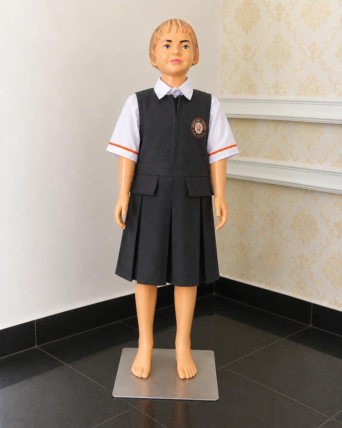 Full view of the same institutional uniform set on a mannequin